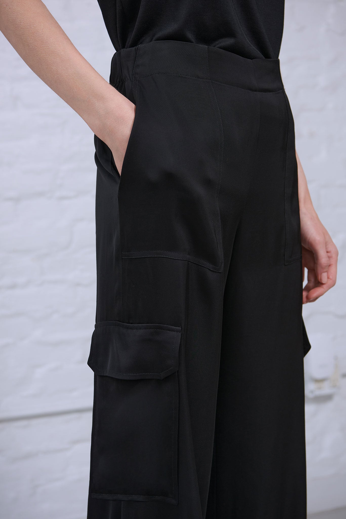 Women's black satin cargo pant with pockets