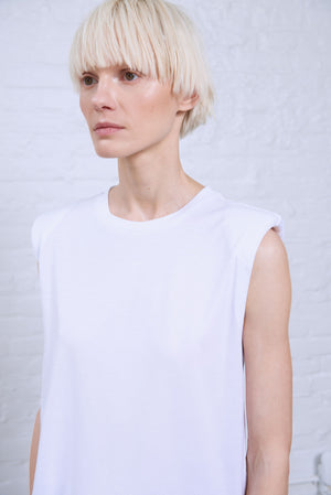 Women's white sleeveless shoulder pad tee detail