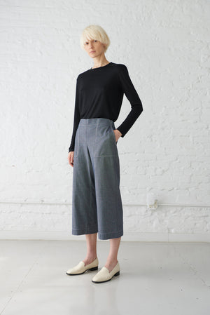 woman wearing denim culottes cropped pant made with organic cotton yarn in dark indigo